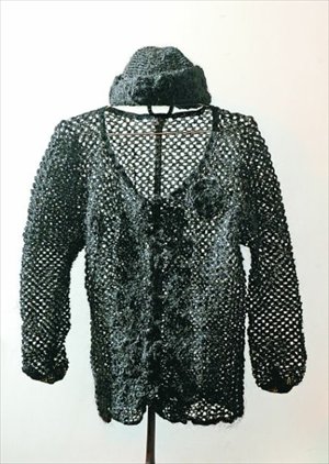 Displayed is a hat and sweater knit from human hair. Sixty-year-old Chongqing resident Xiang Renxian explained she knit the ensemble from her own hair over 11 years. Photo: Chongqing Economic Times