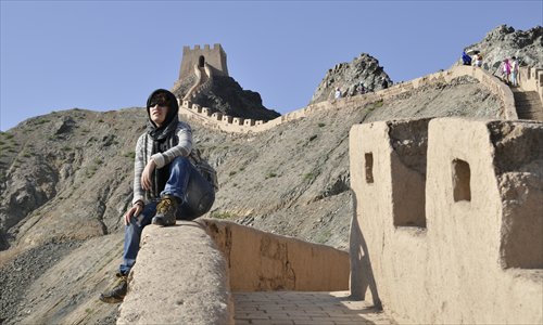 L�� Chengfeng at the Great Wall portion of the Silk Road. Photo: Courtesy of L�� Chengfeng