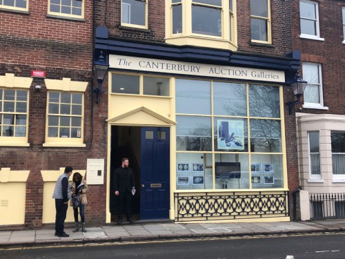 People stand outside Canterbury Auction Galleries on Wednesday after the sale there of a bronze water vessel, known as the Tiger Ying. ��Photo/China Daily��