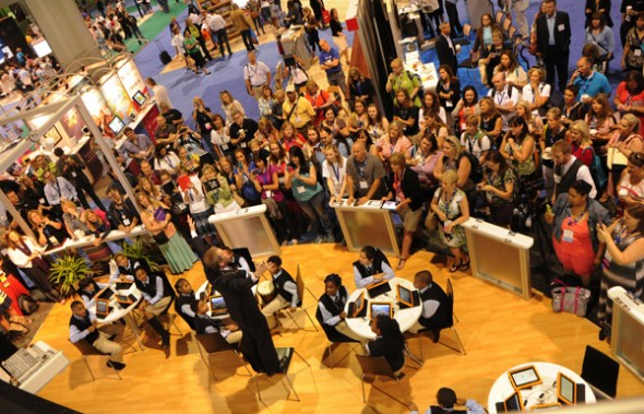Staff of Promethean, a subsidiary of Elernity, interact with the audience at an exhibition of educational equipment in January last year. (Photo provided to China Daily)