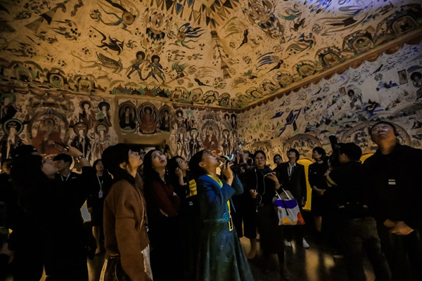 The ongoing show Mysterious Dunhuang, at a temporary exhibition space in Nanshan district in Shenzhen, features reconstructions of individual caves of the Mogao Grottoes. It lets visitors appreciate the art in detail and provides an immersive experience via cutting-edge technology. (Photo provided to China Daily)
